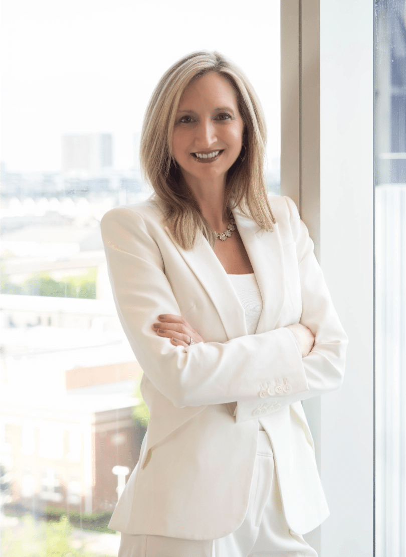 Johnda Denison white suit standing portrait